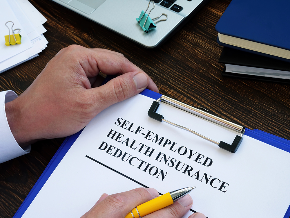 Self employed health insurance deduction application form for signing.