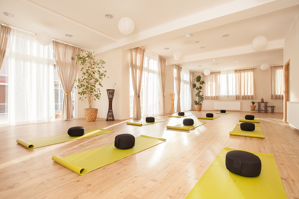 Beautiful, empty naturally lit yoga studio. 