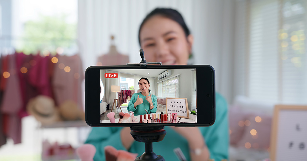 Asia woman micro influencer record live viral video camera at home studio. Happy youtuber fun talk speak advice review hobby in media. Vlogger selfie shoot enjoy work show smile teach like share app.