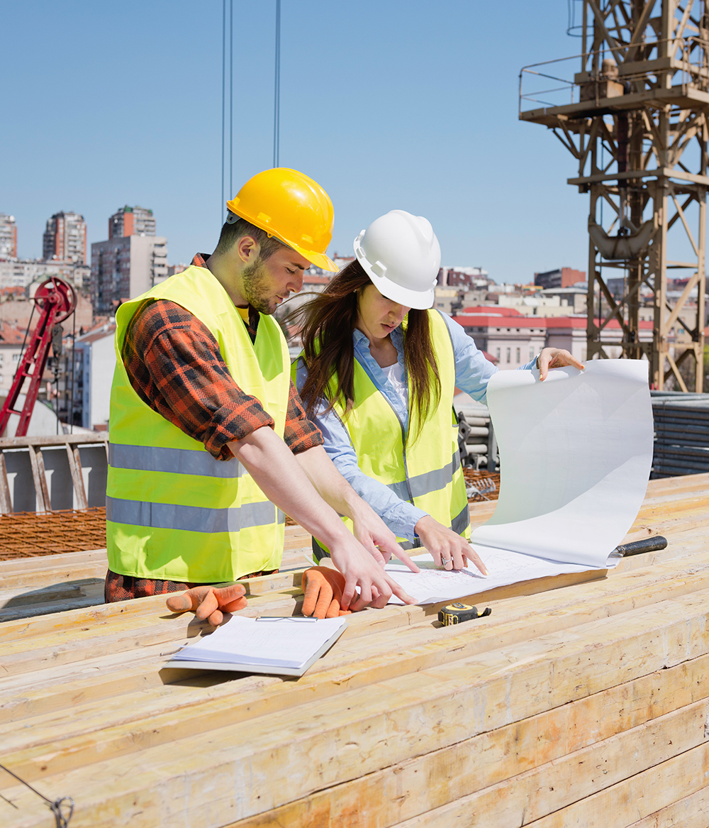 Architect working with construction worker on site