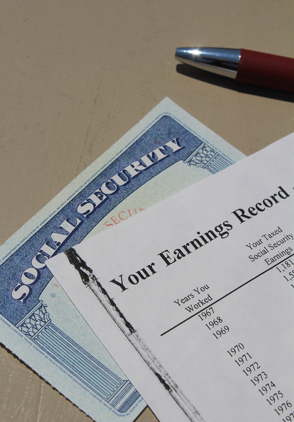Social Security Card With Earnings Record and Pen (Vertical)