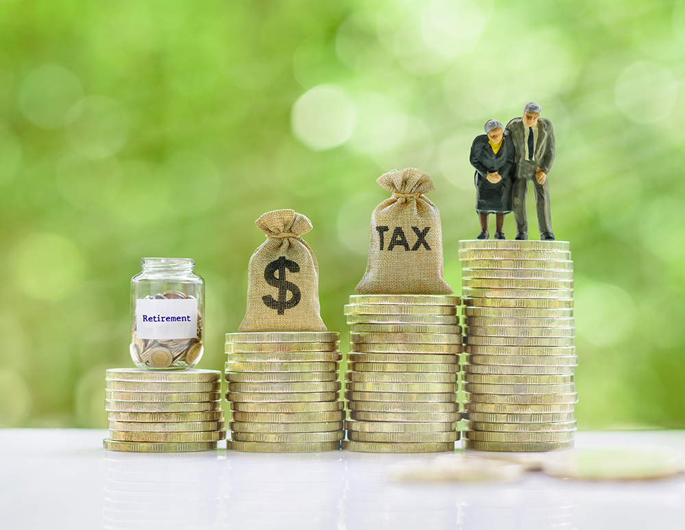 Retirement / pension or income tax and social security benefit concept : Senior american couple, tax bag, US dollar bag, retirement jar on steps of rising coins, depicts preparing money for late life