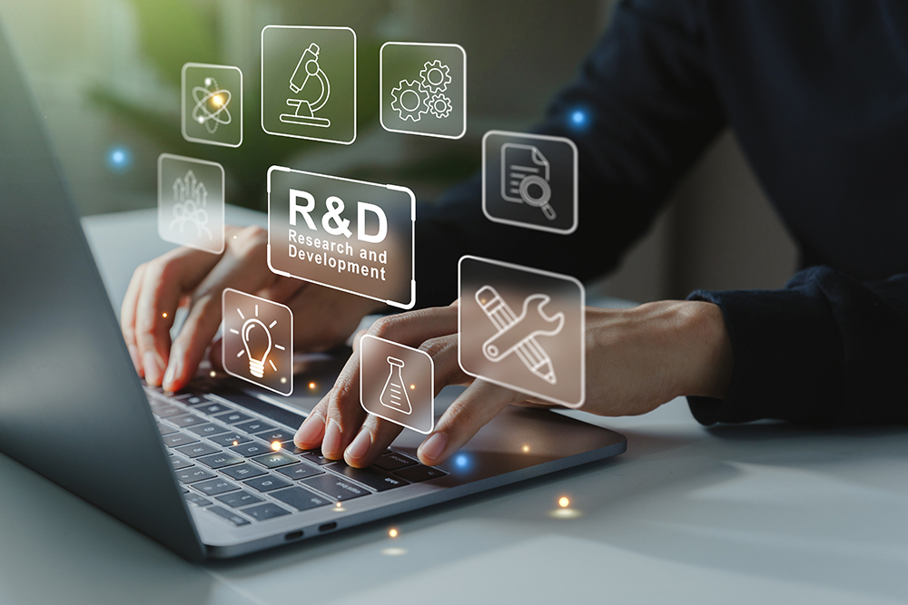 Hand of businessman working to R and D icon for Research and Development on laptop screen, Manage costs more efficiently. R and D innovation concept.