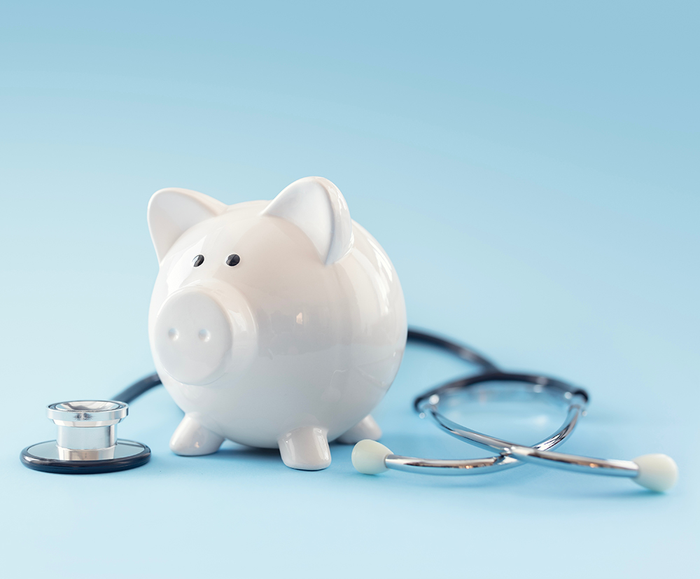Piggy bank with stethoscope background concept for financial health check-up or saving for medical insurance costs