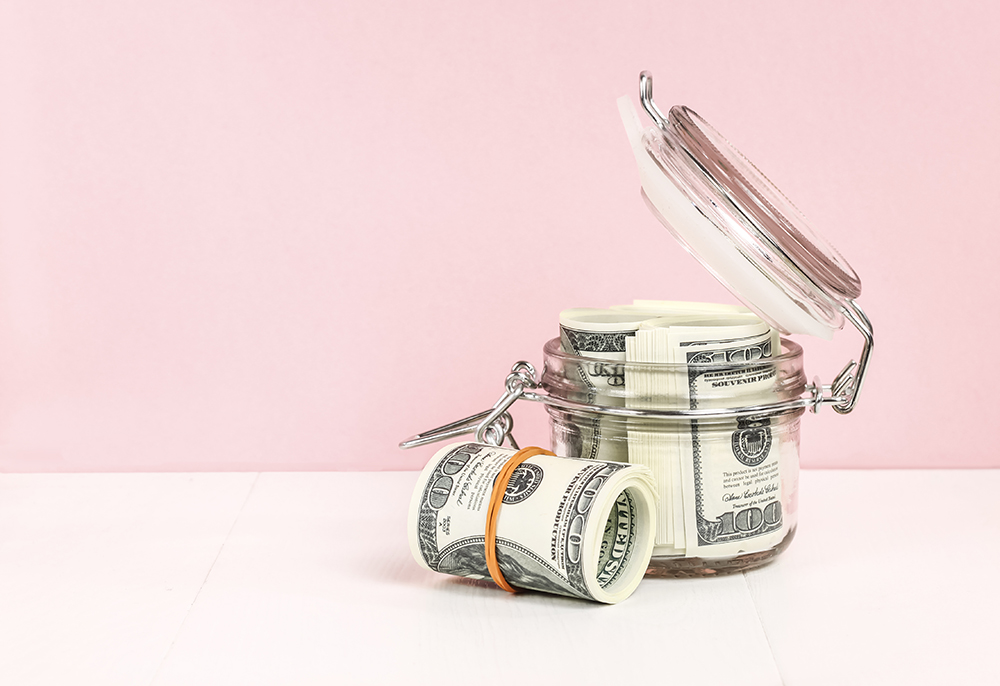 Dollars savings  - Money save concept in glass jar 