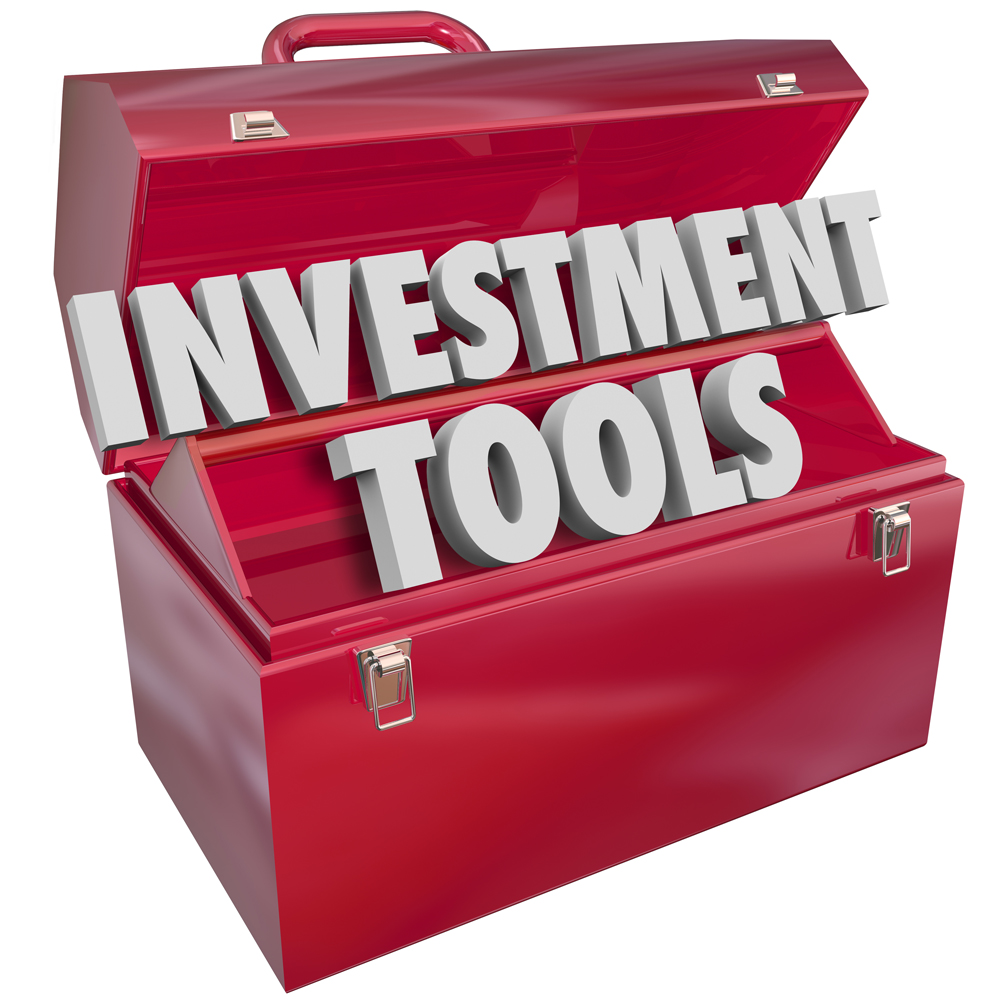 Investment Tools words in 3d letters in a red metal toolbox to illustrate financial advice and resources to help you grow wealth, income and earnings