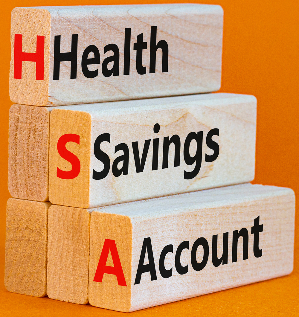HSA health savings account symbol. Concept words HSA health savings account on wooden blocks on a beautiful orange background. Business and HSA health savings account concept.