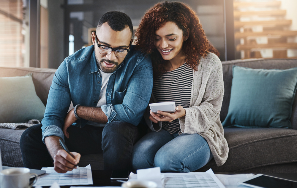 Calculator, financial documents or happy couple with budget paperwork, notes or planning savings. Writing, smile or people organizing bills checklist for paying debt, finance or household expenses