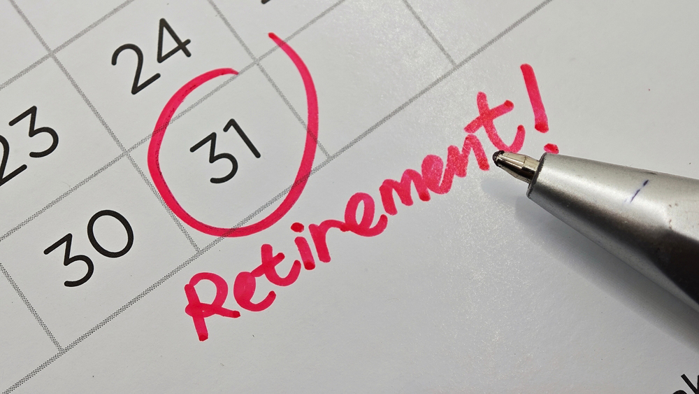 Closeup of a calendar with the 31st date circled in red with retirement text as a note, symbolizing retirement planning, milestone, and life transition. Selective focus.