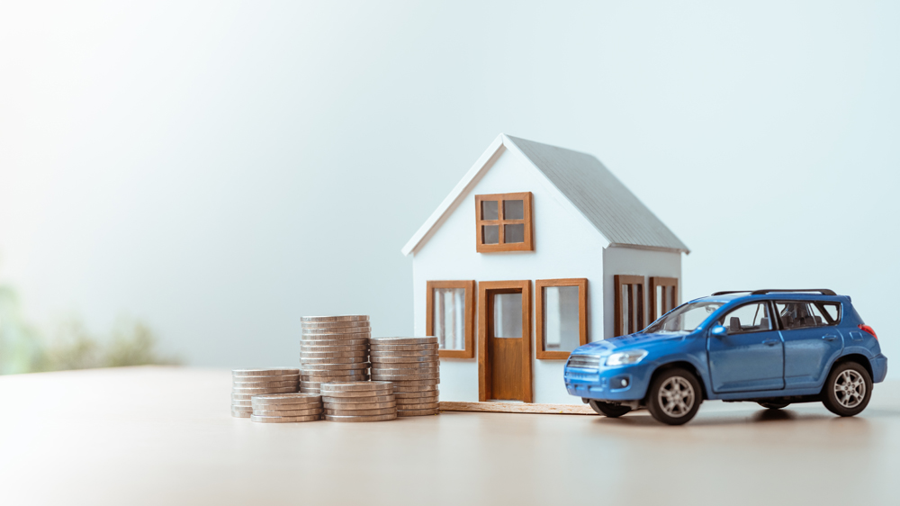 personal, assets, finance, savings, house, car, investment, mortgage, insurance, budget, Model house, car, and stacked coins representing personal finance, savings, and asset investment.